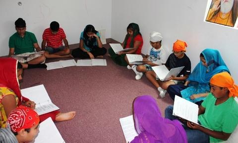 Children in a kids class learning Gurbani
